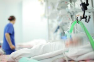 a patient in the ICU awaiting urgent treatment for their medical condition